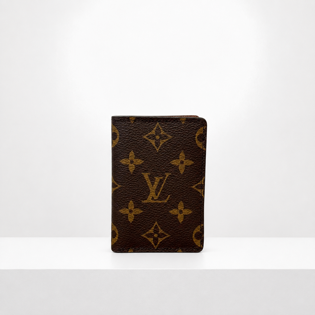 Brown small wallet standing upright on a white surface against a white background.