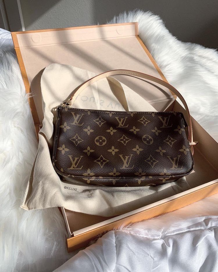 Brown and chocolate checkerboard shoulder bag with dark leather strap, classic 90s style pouch