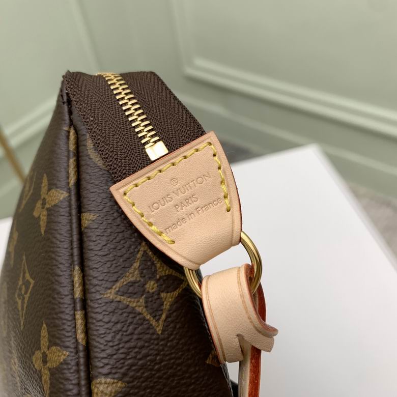 Close up of durable coated canvas in brown check pattern with gold zipper detail.