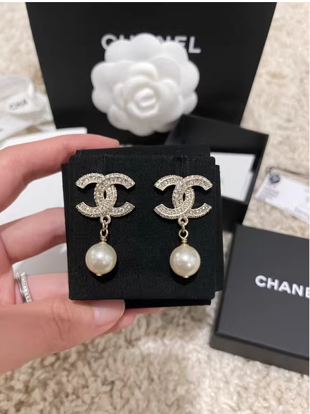 Silver pearl drop earrings with luxury jewelry box and shopping bag, sourced designer alternative.
