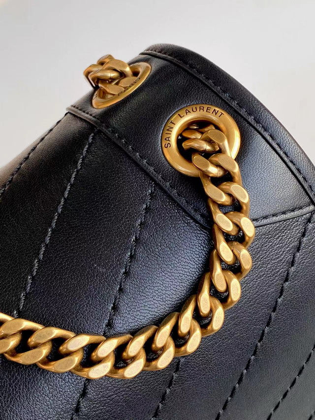 Medium black smooth leather shoulder bag with chevron quilting and antique gold chain strap. Minimalist rock chic style.